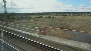 View of outside landscape, shot from running Super fast bullet train from Moscow to St. Petersburg.
