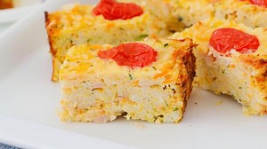 22K views · 59 reactions | A healthy, cheesy vegetable slice made with zucchini, carrot, tomatoes, ham, rice and eggs. A yummy bite-size recipe that's perfect for sneaking a few extra vegetables into your little ones meals. Get the recipe here: https://bakeplaysmile.com/rice-vegetable-slice/ | Bake Play Smile | Facebook
