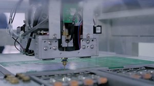 clip-1098964253-automatic-smd-pick-place-machine-during-work