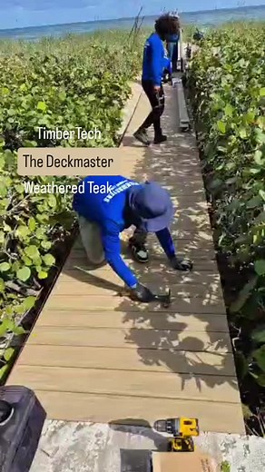 Making progress in the TimberTech Weathered Teak board #timbertech #pvcdecking #deckmastersofsouthflorida #luxurylifestyle #deckbuilding #luxurydecks #deckdesign #boardwalk | Deckmasters of South Florida