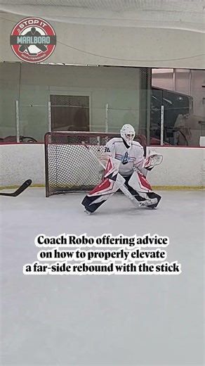 Coach Robo offering advice on how to properly elevate a far-side rebound with the stick