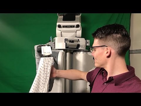 Robot Puts Hospital Gown on a Person