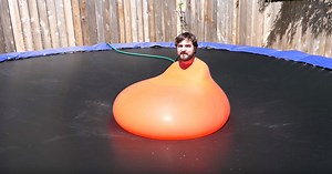 Submerged Inside a 6ft Water Balloon Until It Pops in Super Slow Motion