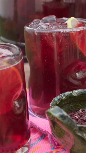 1.6K views · 29 reactions | Agua de Jamaica - A yummy hibiscus flower drink that’s a symphony of tart sweetness, a burst of floral and citrusy deliciousness, and an ode to the rich tapestry of Mexican flavors. RECIPE: https://muybuenoblog.com/agua-de-jamaica-hibiscus-tea/ #FBreels #recipeideas #AguaDeJamaica #JamaicaWater #HibiscusDrink #HibiscusTea #RefreshingBeverage #FlowerDrink #MuyBuenoCooking #MexicanFoodLovers | Muy Bueno Cookbook | Facebook