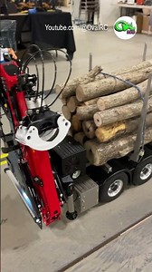 RC Logging truck has a hydraulic crane on the back