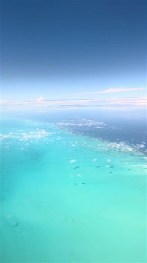 Shallow white coral sand of The Bahamas shows the contrast of deeper water