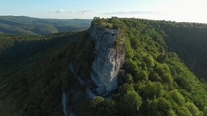 Aerial view Of Beautiful Mountain Range Fly Over High Cliffs. Shot. Rocks Epic Scale High Altitude Nature Landscape Beauty Background Extreme Altitude Drone
