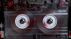 vintage audio cassette fast forwarding and then playback in tape deck