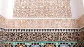 Moroccan interior design with tiles and carved plasterwork, in...