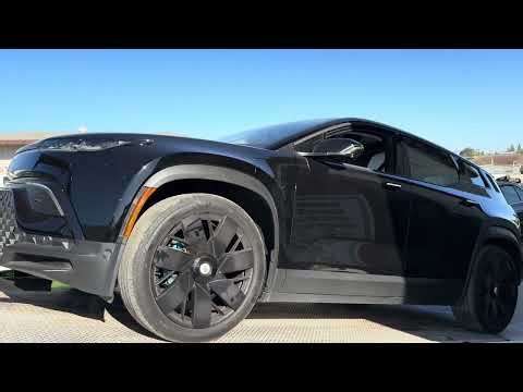 2023 Fisker Ocean loading on flatbed
