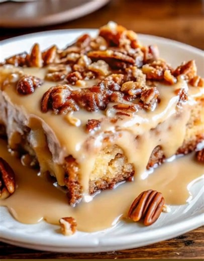 Butter Pecan Praline Poke Cake | Sweet, Sticky & Southern-Style Comfort 🤎🍰 Oh my goodness… this one’s pure decadence! Moist buttery cake soaked with a caramel praline sauce and topped with toasted pecans. It's like grandma’s kitchen in a single bite ❤️ Ingredients: For the Cake: 1 box butter pecan cake mix (or yellow cake mix) 3 large eggs ½ cup vegetable oil 1 cup water 1 cup chopped pecans (to fold in) For the Praline Sauce: 1 (14 oz) can sweetened condensed milk ½ cup brown sugar 4 tbsp but