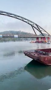 An amazing morning on the Ohio River 😍 Our crews started before the sun came up to get the new Wellsburg Bridge on a barge so we could float it down the river to its permanent home connecting Wellsburg, WV, and Brilliant, OH. | West Virginia Department of Transportation