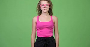 Young Beautiful Nerd Woman with Curly Blond Hair Wearing Eyeglasses
