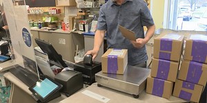 U.S. senators speak with postmaster general about a new bill to improve postal system