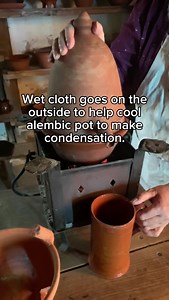 Watch our steam distilling demonstration using an alembic still to create lemon balm... An alembic is a ceramic vessel containing water and herbs that are heated from beneath by hot coals causing the contents of the pot to condense on the inside, enabling the distilled essential oils to be collected for use in medicines, perfumes or for food and drink. | Weald & Downland Living Museum