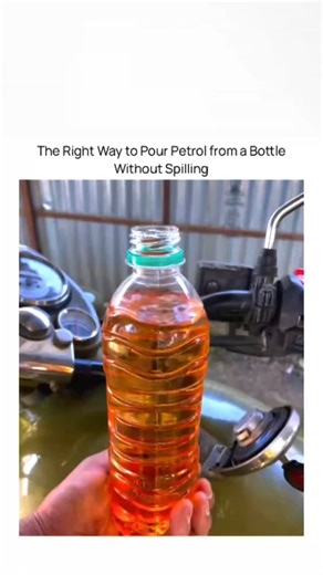 curiosity | Science | Experiment on Instagram: "When fuel has to be transferred from a bottle into a bike or vehicle tank, spillage is usually the biggest problem. A simple trick often shown involves placing plastic wrap (or thin plastic film) over the mouth of the bottle before pouring. Here’s how it works and why it helps: The plastic wrap is stretched tightly over the bottle opening and a small hole is poked in the center. When you tilt the bottle, petrol flows out in a controlled, narrow str