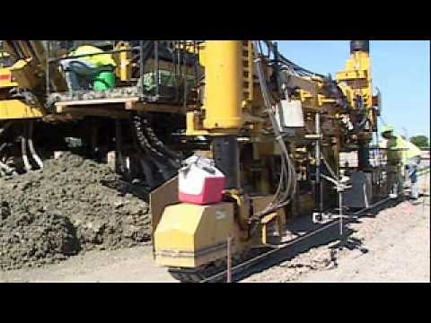 GOMACO Commander III Slipform Paver With IDBI Dowel Bar Inserter Paves Concrete Ramps