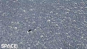 Stunning image of Comet Leonard breakup wins top astronomy photography prize of 2022