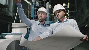 Architects Discussing Factory Layout Plan