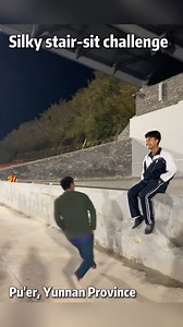 A video from Pu'er, #Yunnan Province, shows teen boys mastering the silkiest jump-and-sit on a stone step—their fluid leaps gliding like silk, bursting with raw youthful fire. #TrendinginChina | WE ARE CHINA