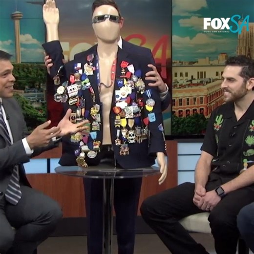 MEDALS IN THE MORNING: Meteorologist Brad Sowder gives "Manny Quin" a hand staying upright while he shows off his Fiesta medals during an interview. | KABB FOX 29 News, San Antonio