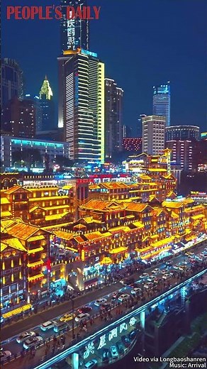 As night falls, the stilted buildings of Hongyadong in SW China's Chongqing awaken in golden lights.