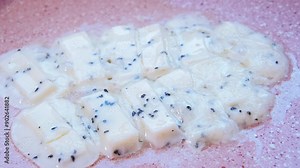 Close-up view of herb cheese melting in a sizzling frying pan, The strings of cheese crisping and bubbling. Cooking , culinary, vegetarian food concepts. 4K Timelapse video with sound. Stock Video