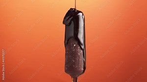 Ice cream on stick, coated with chocolate glaze on an orange background, rotate. Delicious homemade popsicle, pouring with chocolate topping.