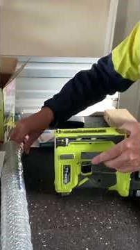 Attaching chicken wire with staple gun.