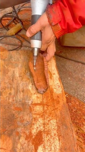Shaping the Wooden Surface Carefully Using a Power Carving Tool for Detailed Design Work