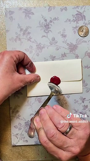 you don't need fancy wax seal sets to create a seal for your envelopes. Metal spoon - check! Tiny candle - check! crayons - check! glue stick - check! quarter - check! use 4 parts glue stick to 2 parts crayon to make this concoction. it works...it really works. You can also use textured buttons to make the impression on the seal too. It really is as easy as it looks. #waxseals #junkjournalideas #papercrafting #easycrafts #junkjournaling