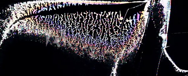 leaking crystals in the form of colored patterns and cracks on the broken screen of a liquid crystal display, computer monitor or tv screen