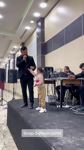 Child Singing Performance on Stage