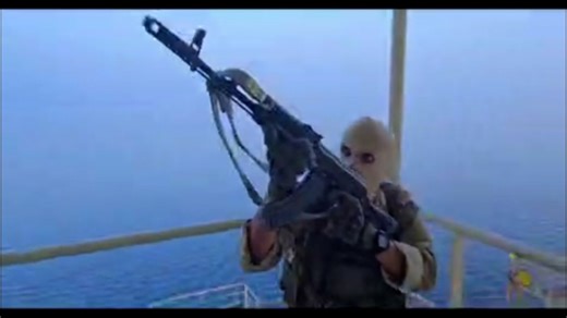The video showed masked men in a small boat approaching a large vessel a boarding it, holding weapons.