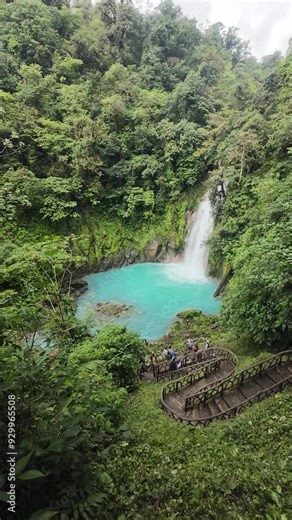 Visiting the Rio Celeste Waterfall in daytime in Tenorio Volcano National Park of Costa Rica