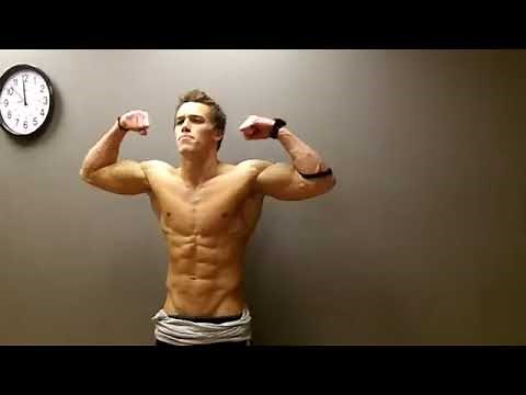 Insane shredded aesthetic bodybuilder flexing