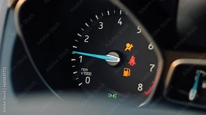 Close-up of a car dashboard with a speedometer. Starting an automobile. Indicators