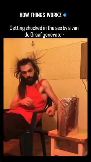 HOW THINGS WORKZ on Instagram: "A Van de Graaff generator uses a moving insulating belt and metal dome to accumulate electrostatic charge, reaching potentials in the megavolt range at extremely low current. When conductive foil is brought near, charge redistributes instantly, creating visible attraction, repulsion, and sudden discharge paths... When a person becomes part of the system, the human body acts as a conductive reservoir. The shock occurs when stored charge equalizes through the shorte