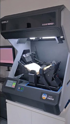 ISCAN Automatic Scanner Robot with a scanning speed of 2,000 - 3,300 pages per hour.