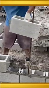 Carefully installing lightweight wall blocks on the foundation to ensure perfect alignment #concrete