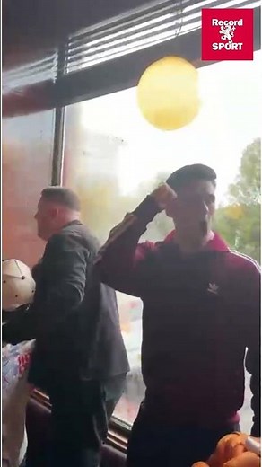 Hearts fans celebrate in Tynecastle Arms at the Jambos score twice against Falkirk