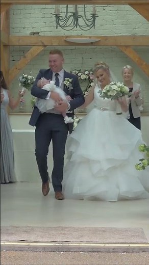 Bride & Groom and Baby Walk Up The Aisle