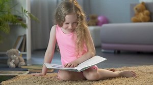 Little Kid Reading Laughing Funny Story Stock Footage Video (100% Royalty-free) 1008156463 | Shutterstock