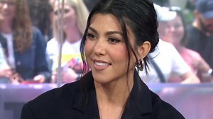 Kourtney Kardashian displays baby bump in green bikini