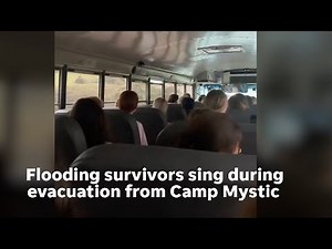 Camp Mystic survivors sing on bus during evacuation while passing scenes of Texas flooding damage