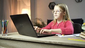 Girl typing on the computer at her desk - Free Stock Video