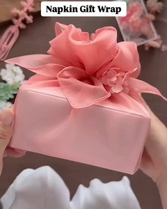 Napkin Gift Wrap 🎁 Our Organza napkins are a perfect way to wrap small gifts. Check out our extensive collection of linens, chair covers, and napkins. We deliver nationwide! | Connie Duglin Linen Rental