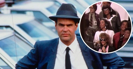The Funny Story Behind Dan Aykroyd Singing 'We Are The World' In 1985