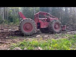 Old log skidder. Timberjack 230 with 353 Detroit diesel running in the woods