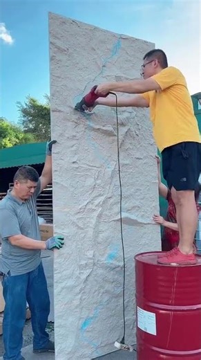 workers are cutting concrete sheets using machines according to the specified shape